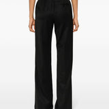 Close-up of Balenciaga pants hardware and fine stitching