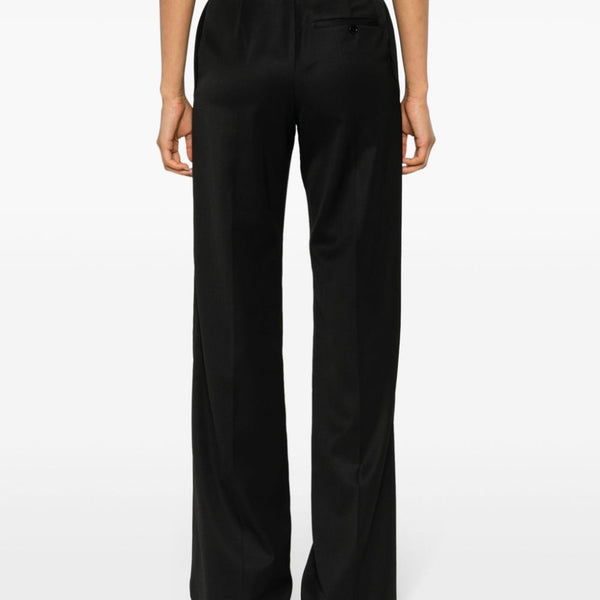 Close-up of Balenciaga pants hardware and fine stitching