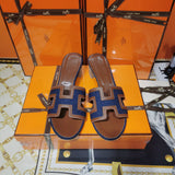 Hermes sandals Style 053 - close-up of iconic logo design
