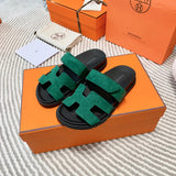 Hermès Grey Flat Thong Sandals - Angled View