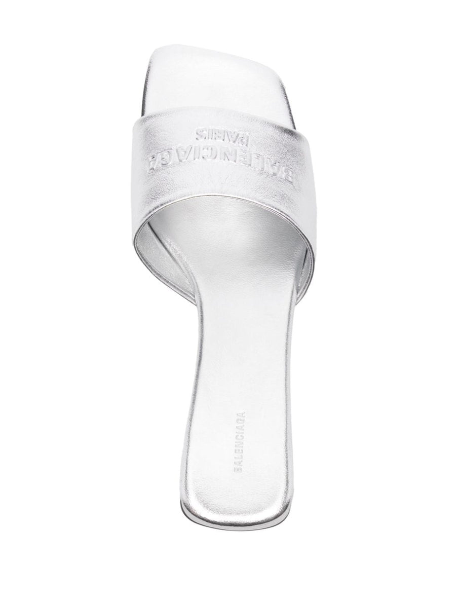 Close-up of Balenciaga sandals hardware and fine stitching