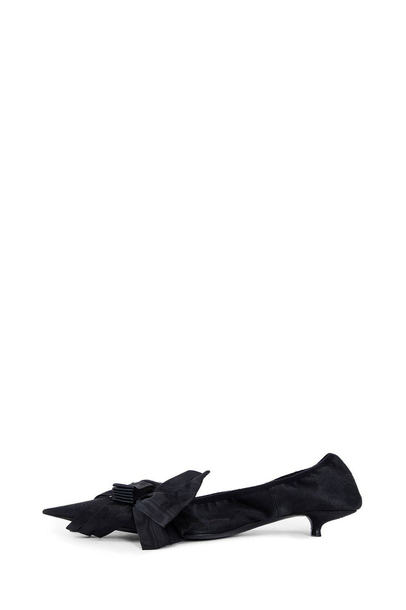 Close-up of Balenciaga pumps hardware and fine stitching