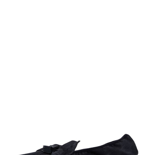 Close-up of Balenciaga pumps hardware and fine stitching