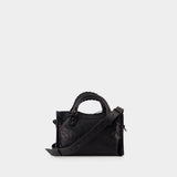 Close-up of Balenciaga handbags hardware and fine stitching