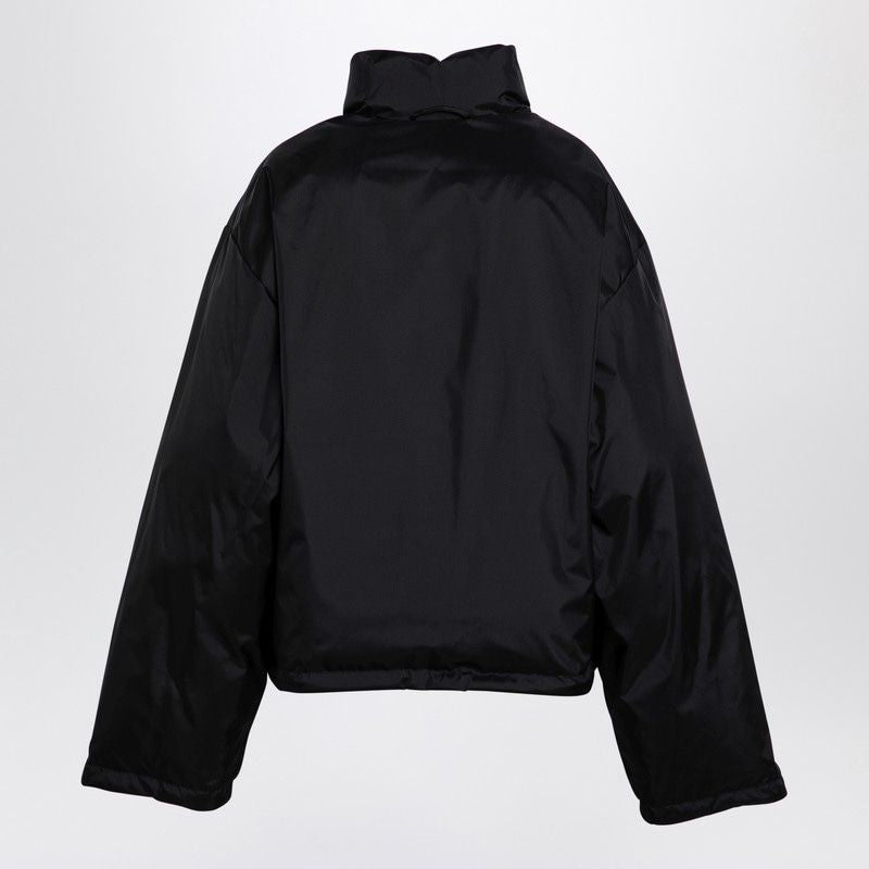 Close-up of Balenciaga outerwear hardware and fine stitching