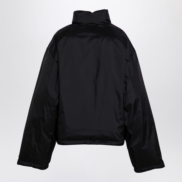 Close-up of Balenciaga outerwear hardware and fine stitching