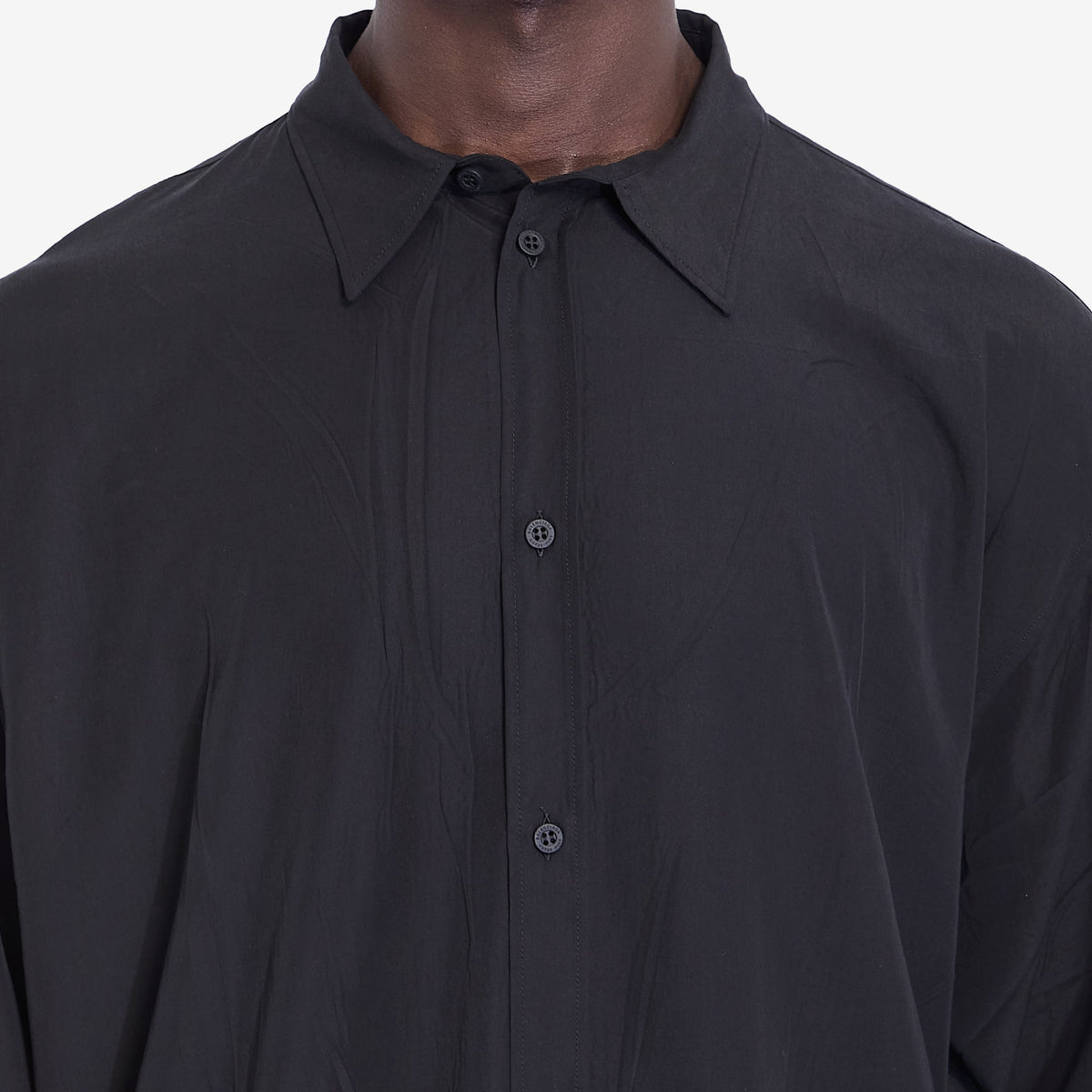 Close-up of Balenciaga shirts hardware and fine stitching
