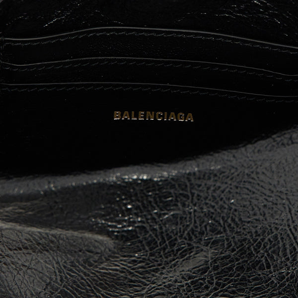 Close-up of Balenciaga cross body bags hardware and fine stitching