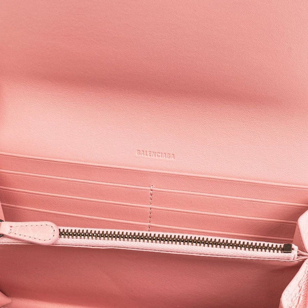 Close-up of Balenciaga small leather goods hardware and fine stitching