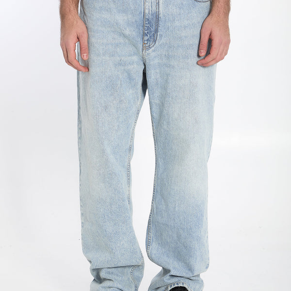 Close-up of Balenciaga pants hardware and fine stitching