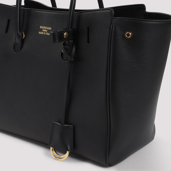 Close-up of Balenciaga shopping bags hardware and fine stitching