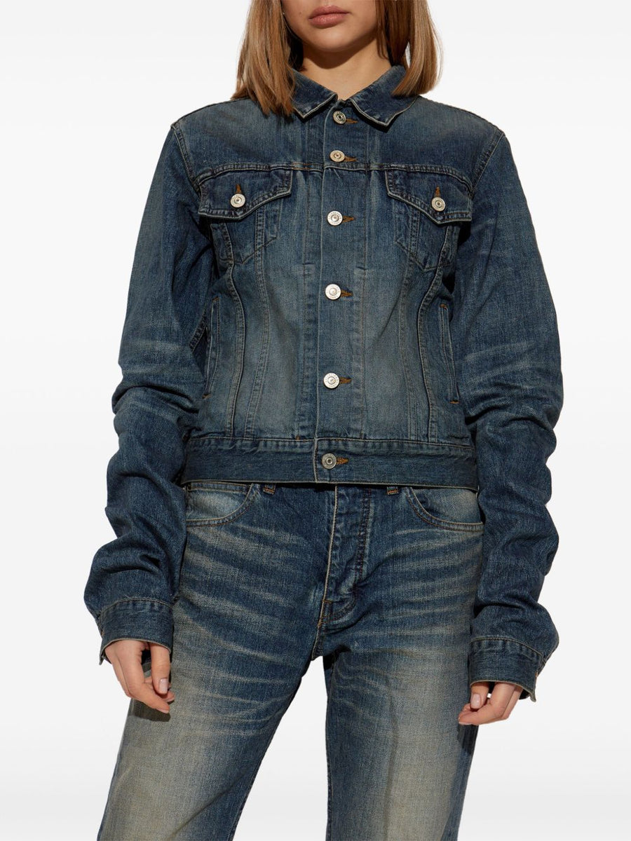 Close-up of Balenciaga outerwear hardware and fine stitching