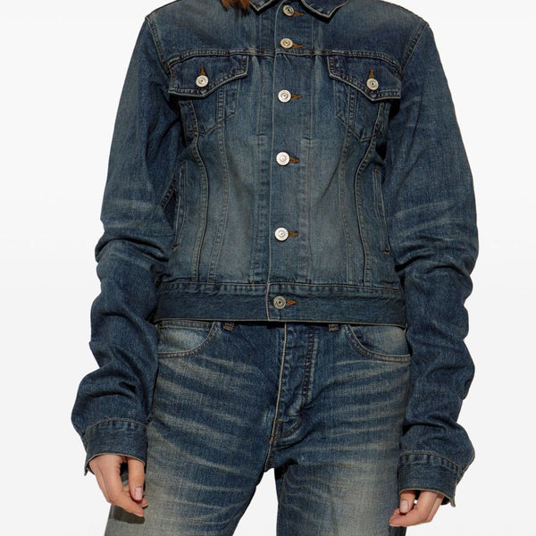 Close-up of Balenciaga outerwear hardware and fine stitching