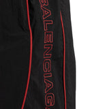 Close-up of Balenciaga pants hardware and fine stitching