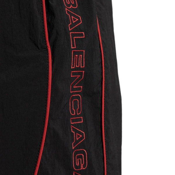 Close-up of Balenciaga pants hardware and fine stitching
