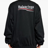 Close-up of Balenciaga outerwear hardware and fine stitching