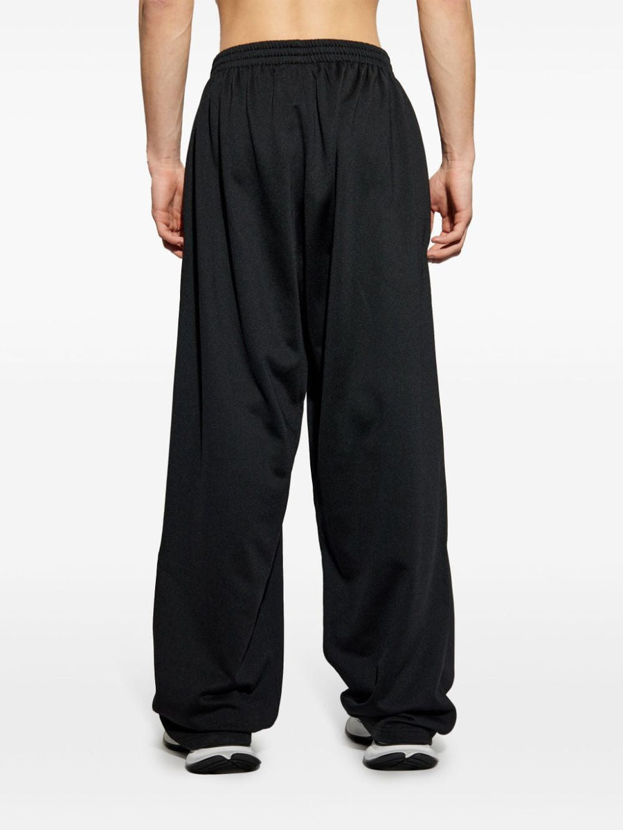 Close-up of Balenciaga pants hardware and fine stitching