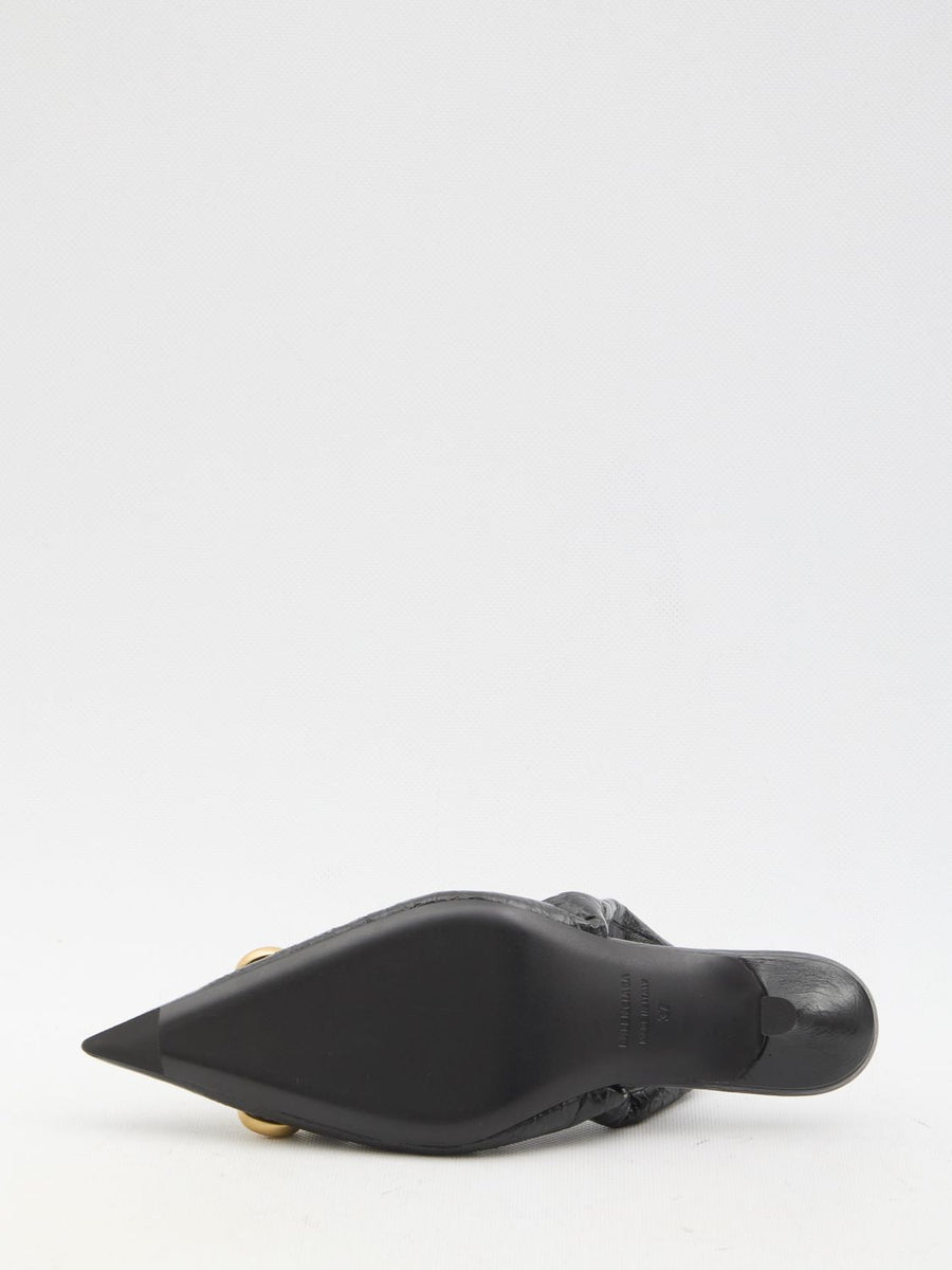 Close-up of Balenciaga pumps hardware and fine stitching