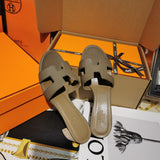 Hermès Tan Flat Thong Sandals - Close-Up Texture View