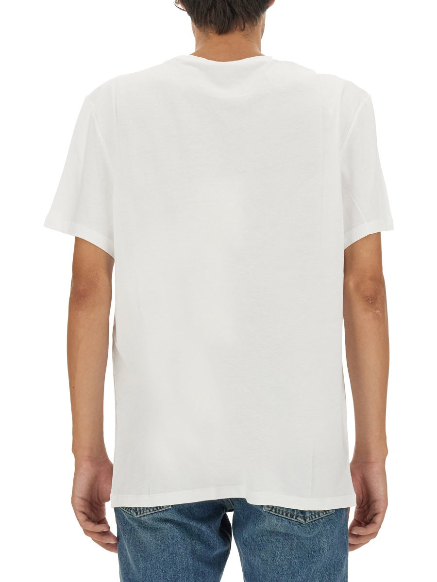 Close-up of Alexander McQueen tee shirts hardware and fine stitching