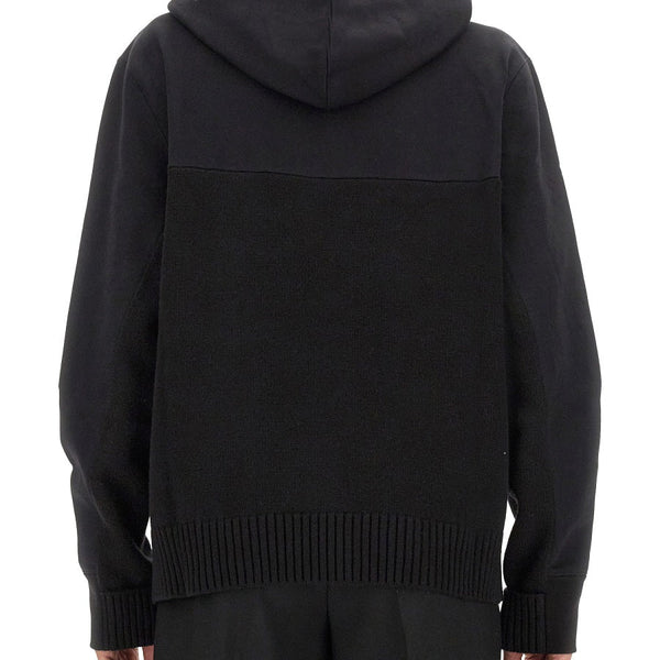 Close-up of Alexander McQueen sweaters & pullovers hardware and fine stitching