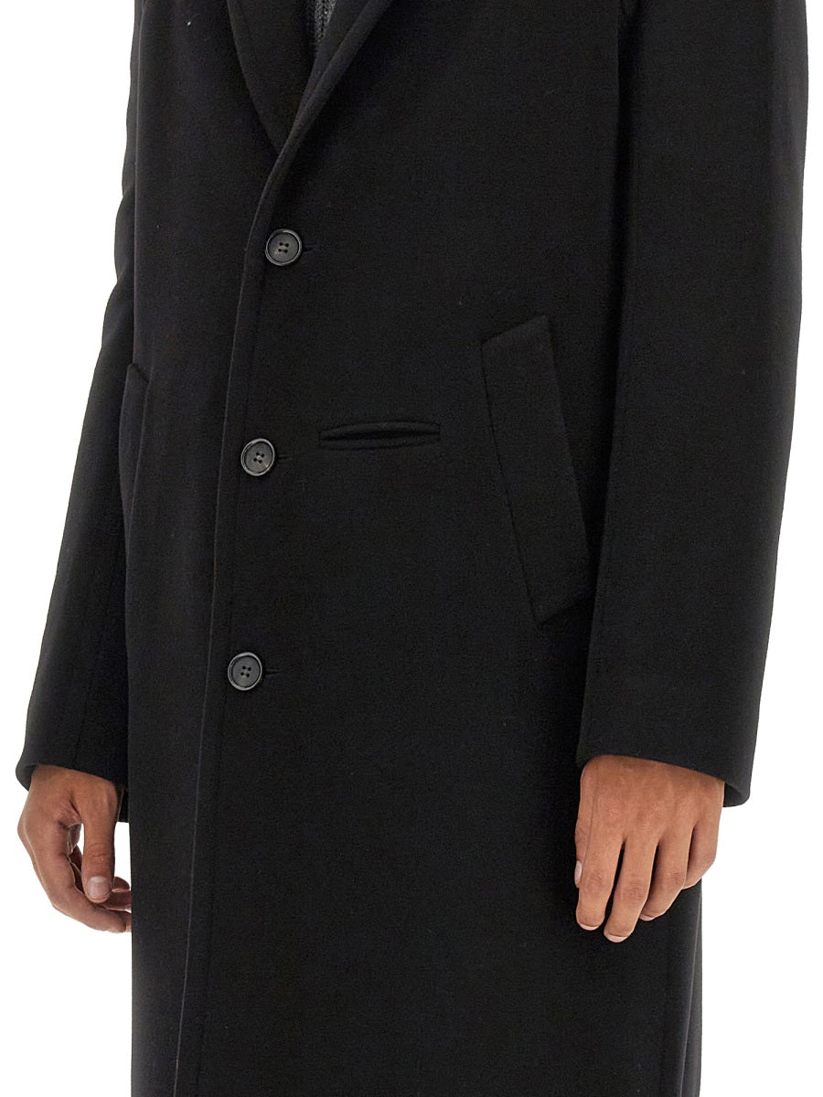 Close-up of Alexander McQueen coats hardware and fine stitching