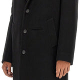 Close-up of Alexander McQueen coats hardware and fine stitching
