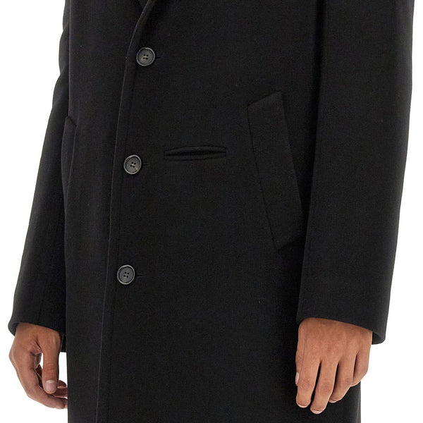 Close-up of Alexander McQueen coats hardware and fine stitching