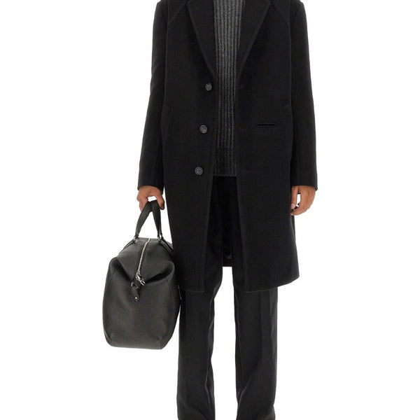 Alexander McQueen premium coats detail and craftsmanship close-up