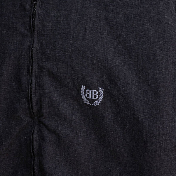 Close-up of Balenciaga outerwear hardware and fine stitching