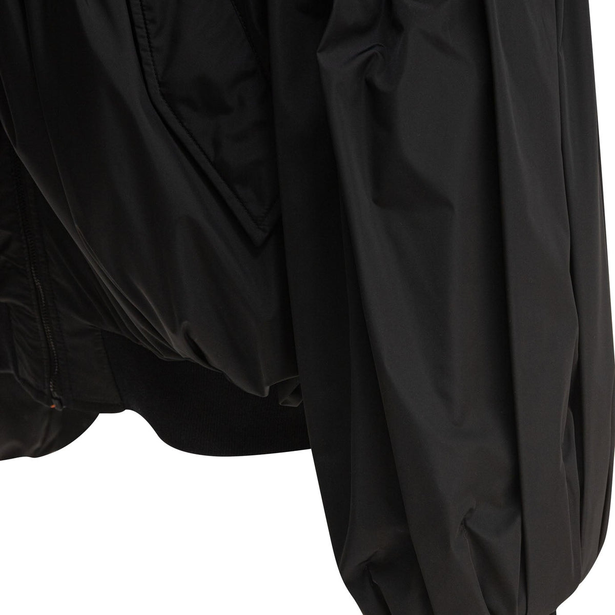 Close-up of Balenciaga outerwear hardware and fine stitching