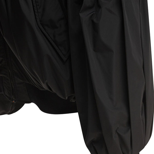 Close-up of Balenciaga outerwear hardware and fine stitching