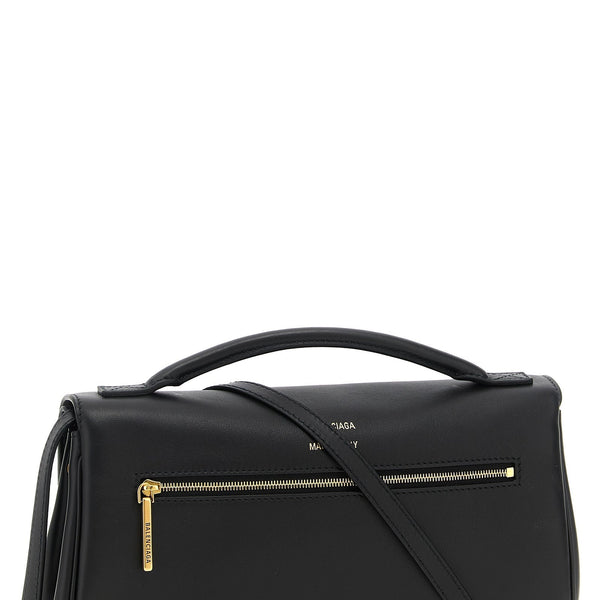 Balenciaga premium clutches detail and craftsmanship close-up