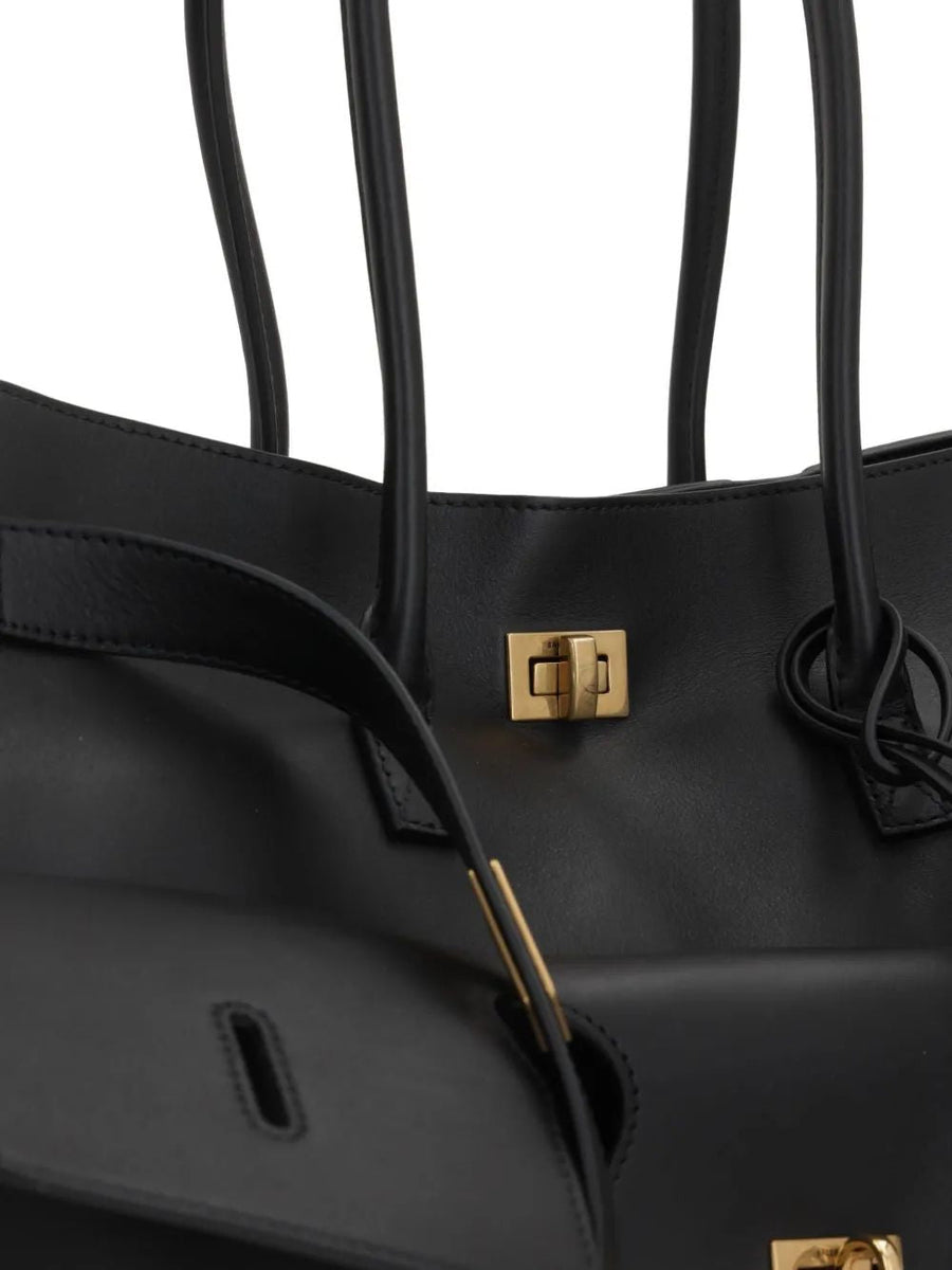 Close-up of Balenciaga totes hardware and fine stitching