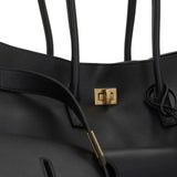 Close-up of Balenciaga totes hardware and fine stitching
