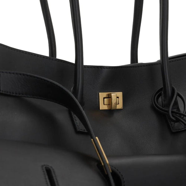 Close-up of Balenciaga totes hardware and fine stitching