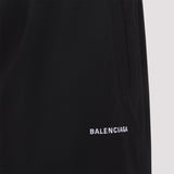 Close-up of Balenciaga pants hardware and fine stitching
