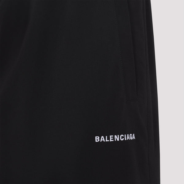 Close-up of Balenciaga pants hardware and fine stitching