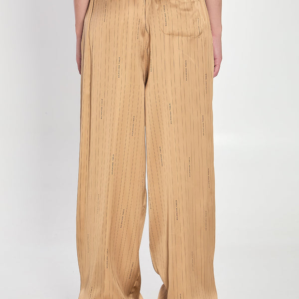Close-up of Balenciaga pants hardware and fine stitching