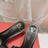 Three-quarter angle view of Valentino Garavani luxury piece style No.249