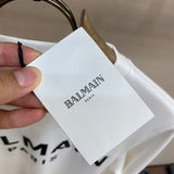 Side profile view of Balmain luxury piece style No.036