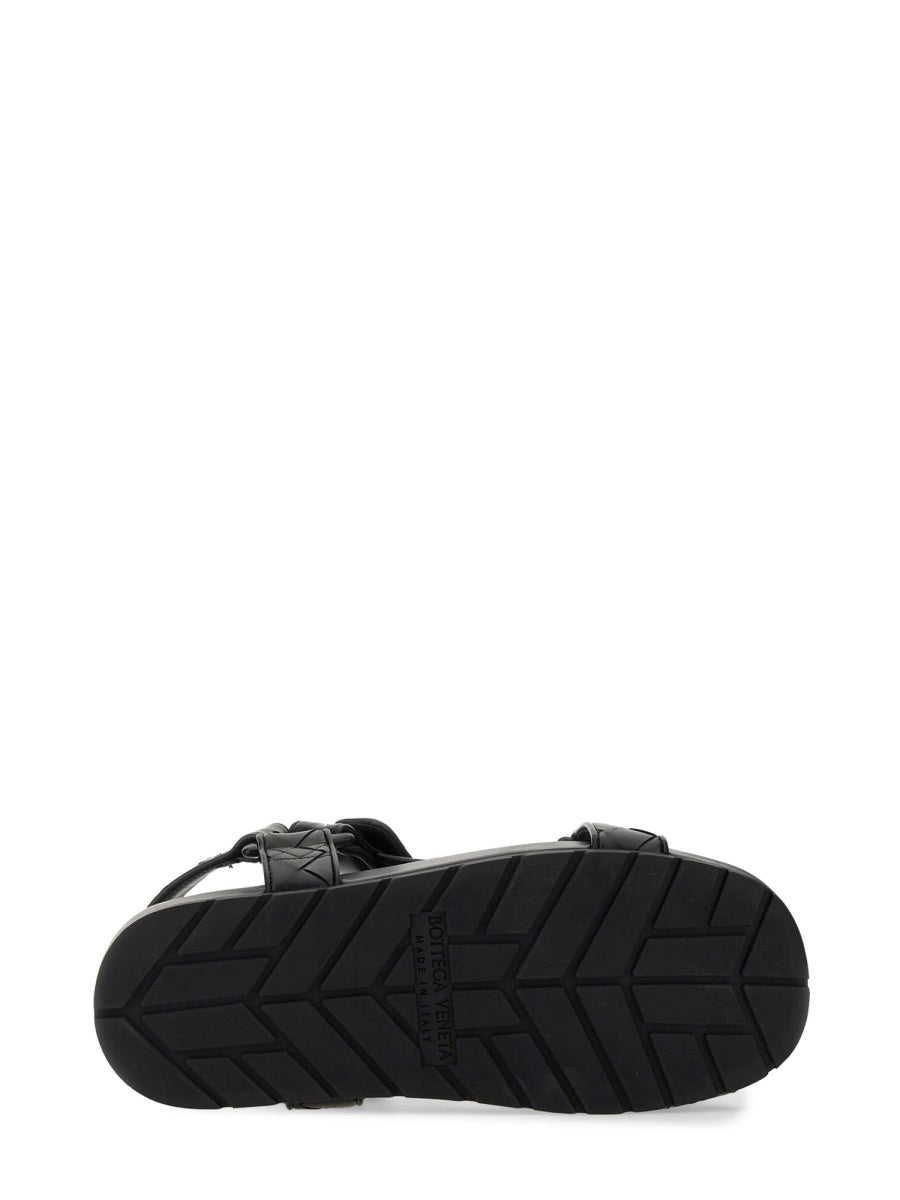 Close-up of Bottega Veneta sandals hardware and fine stitching