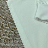 Three-quarter angle view of Amiri luxury piece style No.063
