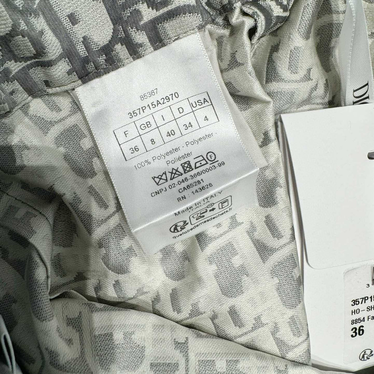 Close-up of Christian Dior Shorts signature hardware and stitching detail