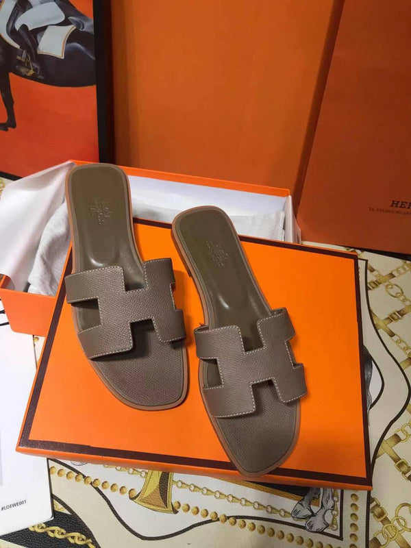 Hermès Grey Crisscross Strap Sandals - Angled View