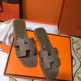 Hermès Grey Crisscross Strap Sandals - Angled View