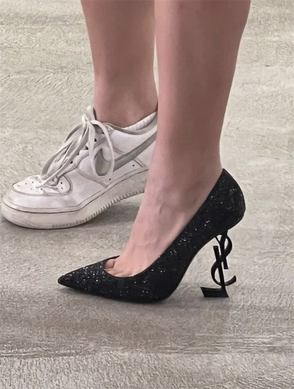 Side profile view of Saint Laurent luxury piece style No.064