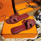 Hermès Grey Slide Sandals - Heel Detail View