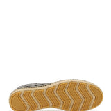 Close-up of Bottega Veneta slides hardware and fine stitching