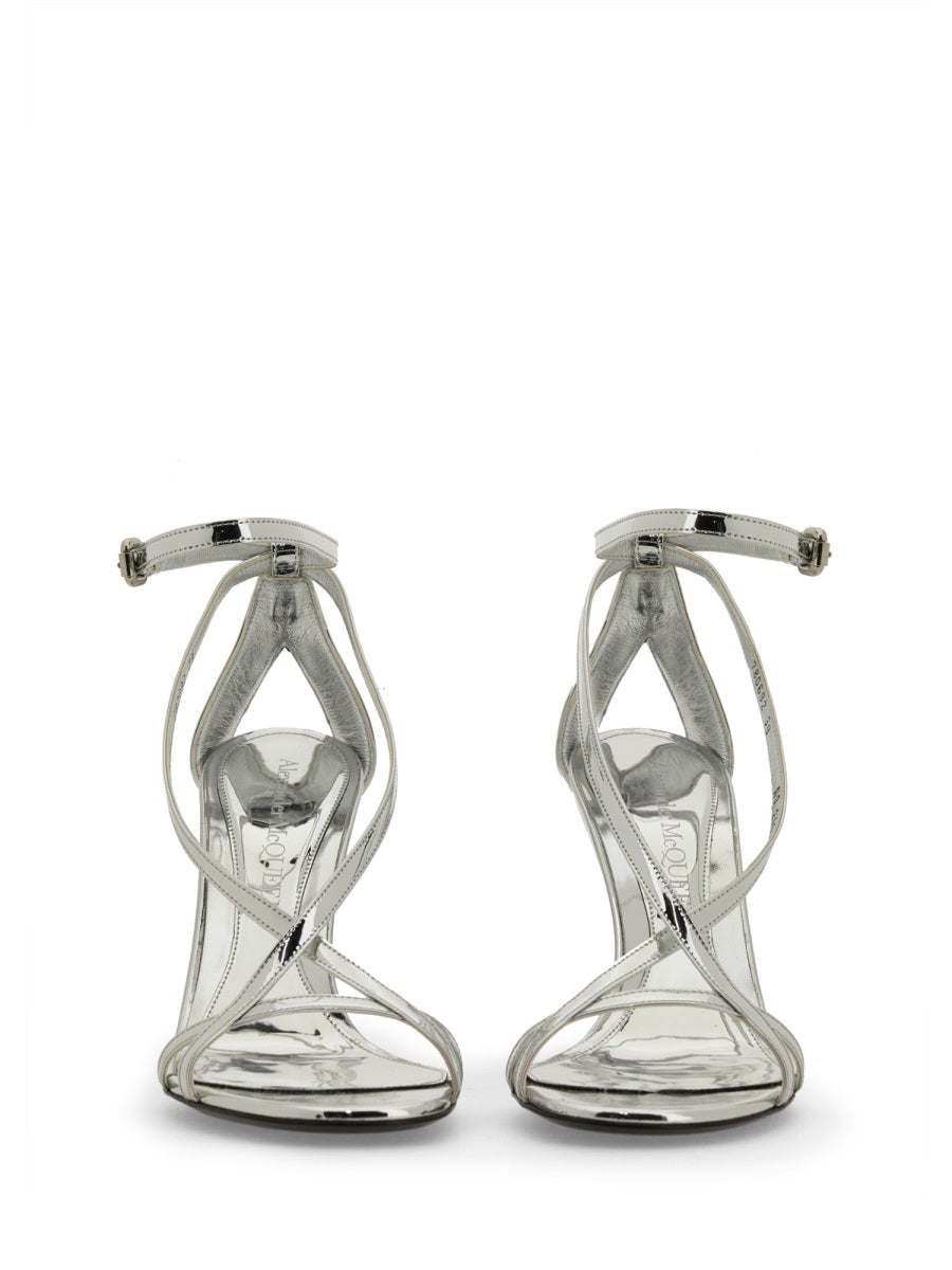 Close-up of Alexander McQueen sandals hardware and fine stitching